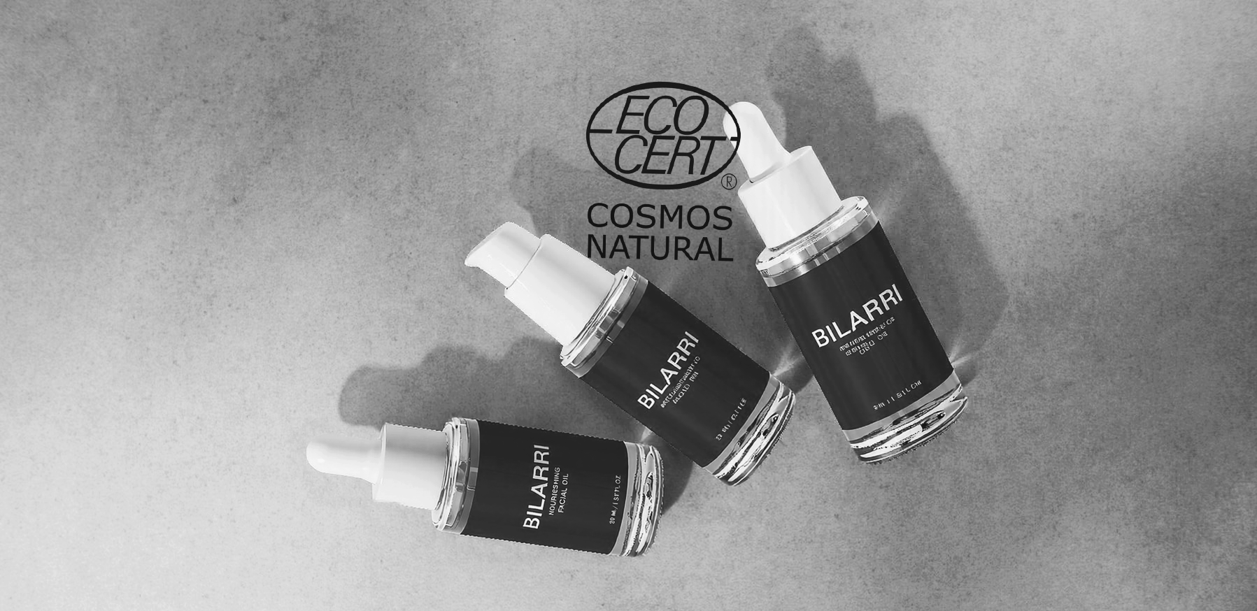 Three BILARRI skincare dropper bottles on a gray surface with a logo in the corner. Best skincare serum
2. Vitamin C serum
3. Face serum for glowing skin
4. Anti-aging serum
5. Hydrating face serum
6. Vegan cruelty-free skincare serum
7. Natural anti-aging face serum
8. Serum for acne-prone skin
9. Collagen boosting serum
10. Buy face serum online