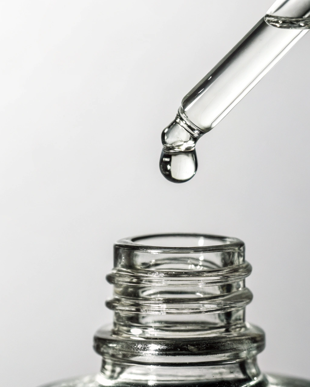 Glass dropper with a drop of liquid over a clear glass bottle on a light gray background.Best skincare serum
2. Vitamin C serum
3. Face serum for glowing skin
4. Anti-aging serum
5. Hydrating face serum
6. Vegan cruelty-free skincare serum
7. Natural anti-aging face serum
8. Serum for acne-prone skin
9. Collagen boosting serum
10. Buy face serum online