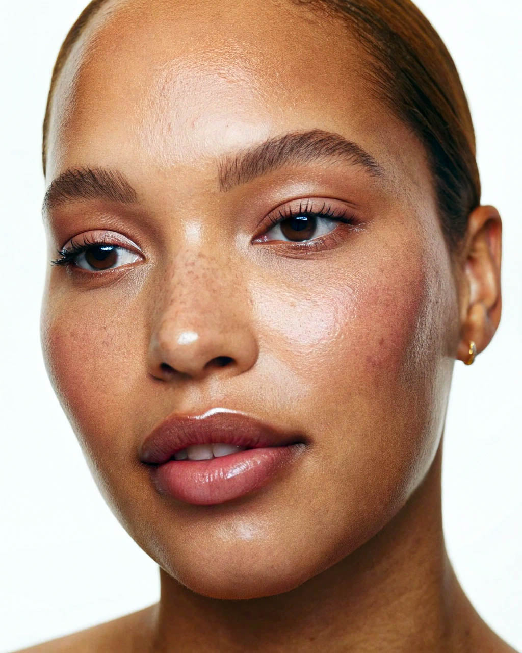 Close-up of a woman's face with a neutral background