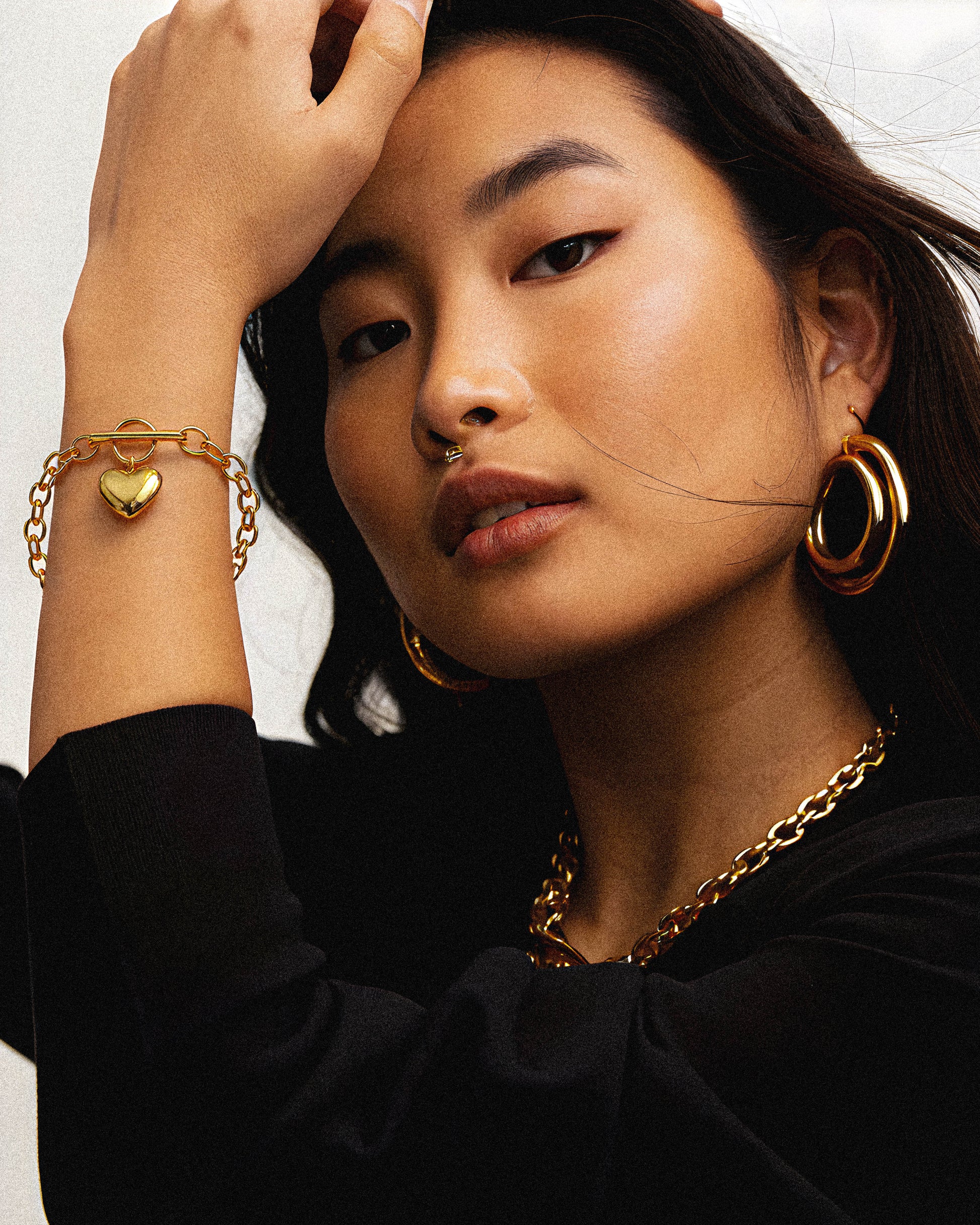 The Mirella Bracelet features a delicate gold heart charm, elegantly plated in 18k gold for lasting shine and sophistication. This refined piece offers a subtle yet timeless accessory, perfect for enhancing any outfit with a touch. 1.	18k gold plated jewelry
	2.	gold plated stainless steel jewelry
	3.	tarnish free gold jewelry
	4.	waterproof gold jewelry
	5.	affordable gold jewelry
	6.	non-tarnish gold jewelry
	7.	hypoallergenic gold jewelry
	8.	durable gold plated jewelry
	9.	everyday gold jewelry
	10.	buy