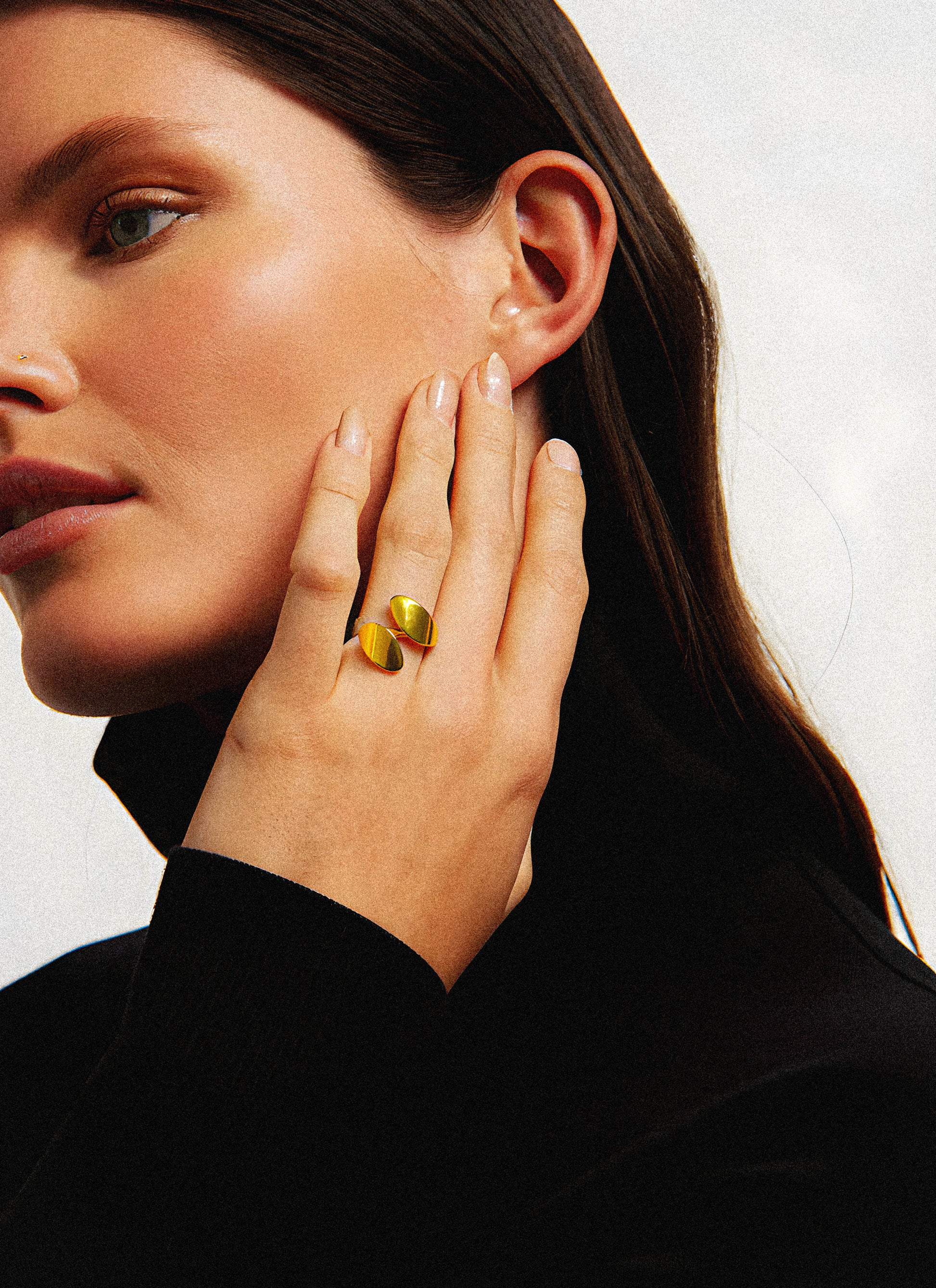 The Mirra Ring is a stylish addition to any jewelry collection, crafted from solid gold to ensure lasting quality and elegance. Its sleek design complements both casual and formal fashion, making it a versatile accessory for those who appreciate refined craftsmanship and timeless style. Perfect for elevating your everyday look or adding a subtle statement to special occasions.
