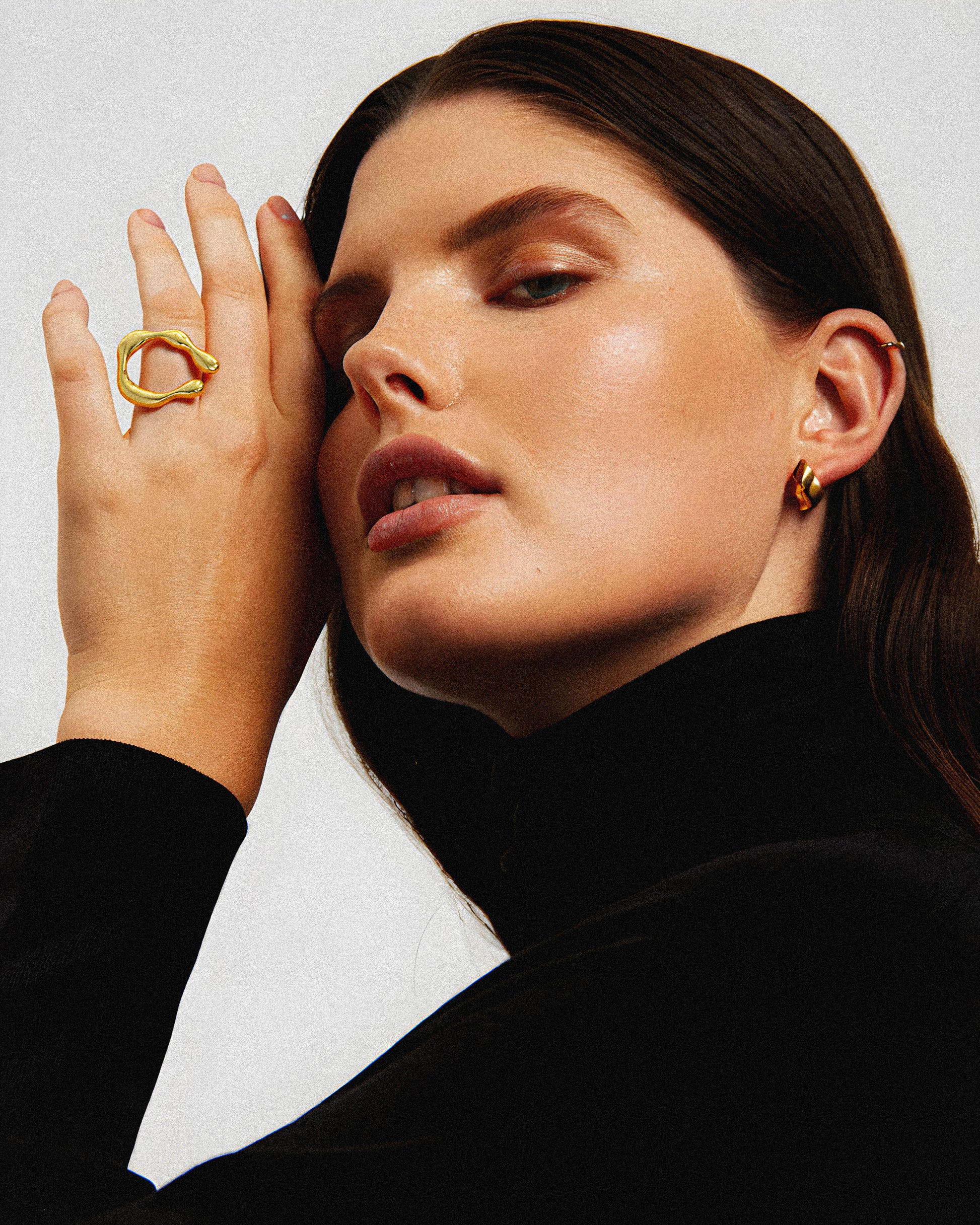 The Obsidian Ring showcases a sculptural design that emphasizes geometric precision and modern. Crafted to highlight clean lines and bold shapes, this ring offers a distinctive statement piece for those who appreciate refined artistry in jewelry. Its architectural form complements both casual and formal styles, making it a versatile addition to any collection. 