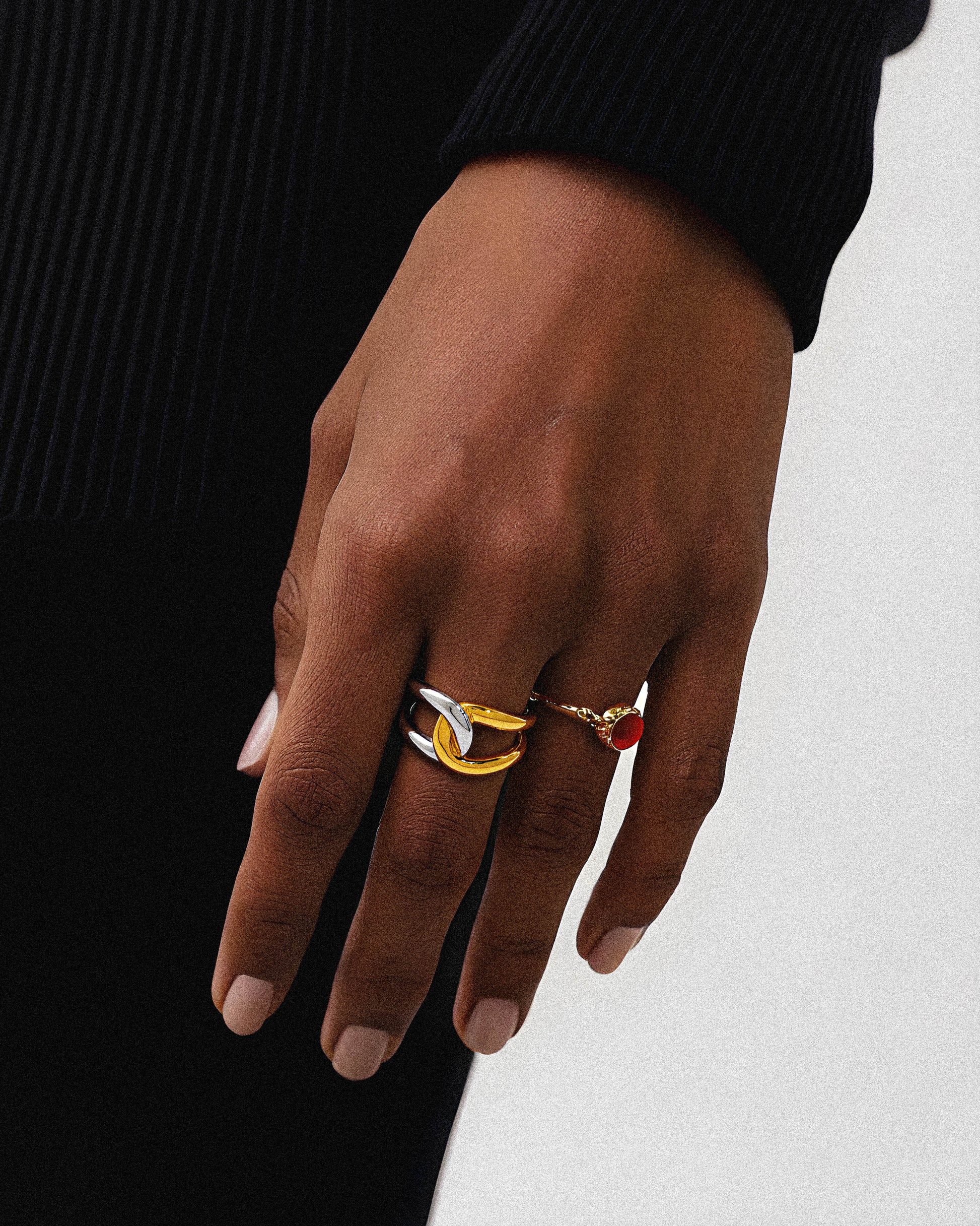 Ather ring

The Aether Ring is a bold statement piece crafted with a solid, substantial design and finished in luxurious 18k gold plating. Its impressive size and rich gold tone offer a timeless making it an ideal accessory for those seeking both durability and refined style. Perfect for elevating any outfit, this ring combines expert craftsmanship with classic sophistication.