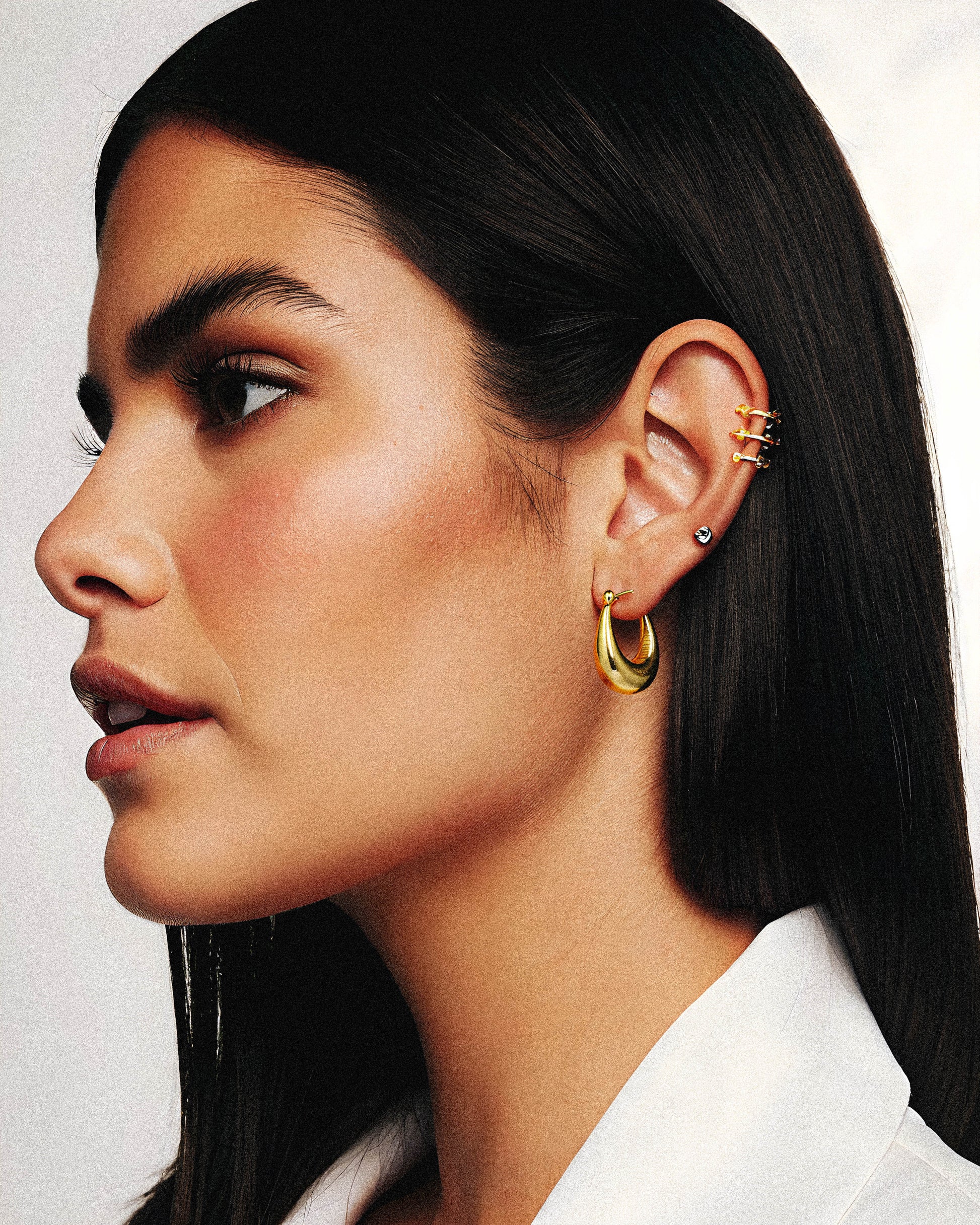 &nbsp;the Sunbeam Earring, crafted from solid gold. Its refined design captures the radiant beauty of sunlight, offering a timeless accessory that complements any sophisticated ensemble. Perfect for adding a subtle yet striking touch of luxury to your look..1.	18k gold plated jewelry
	2.	gold plated stainless steel jewelry
	3.	tarnish free gold jewelry
	4.	waterproof gold jewelry
	5.	affordable gold jewelry
	6.	non-tarnish gold jewelry
	7.	hypoallergenic gold jewelry
	8.	durable gold plated jewelry
	9.	ever