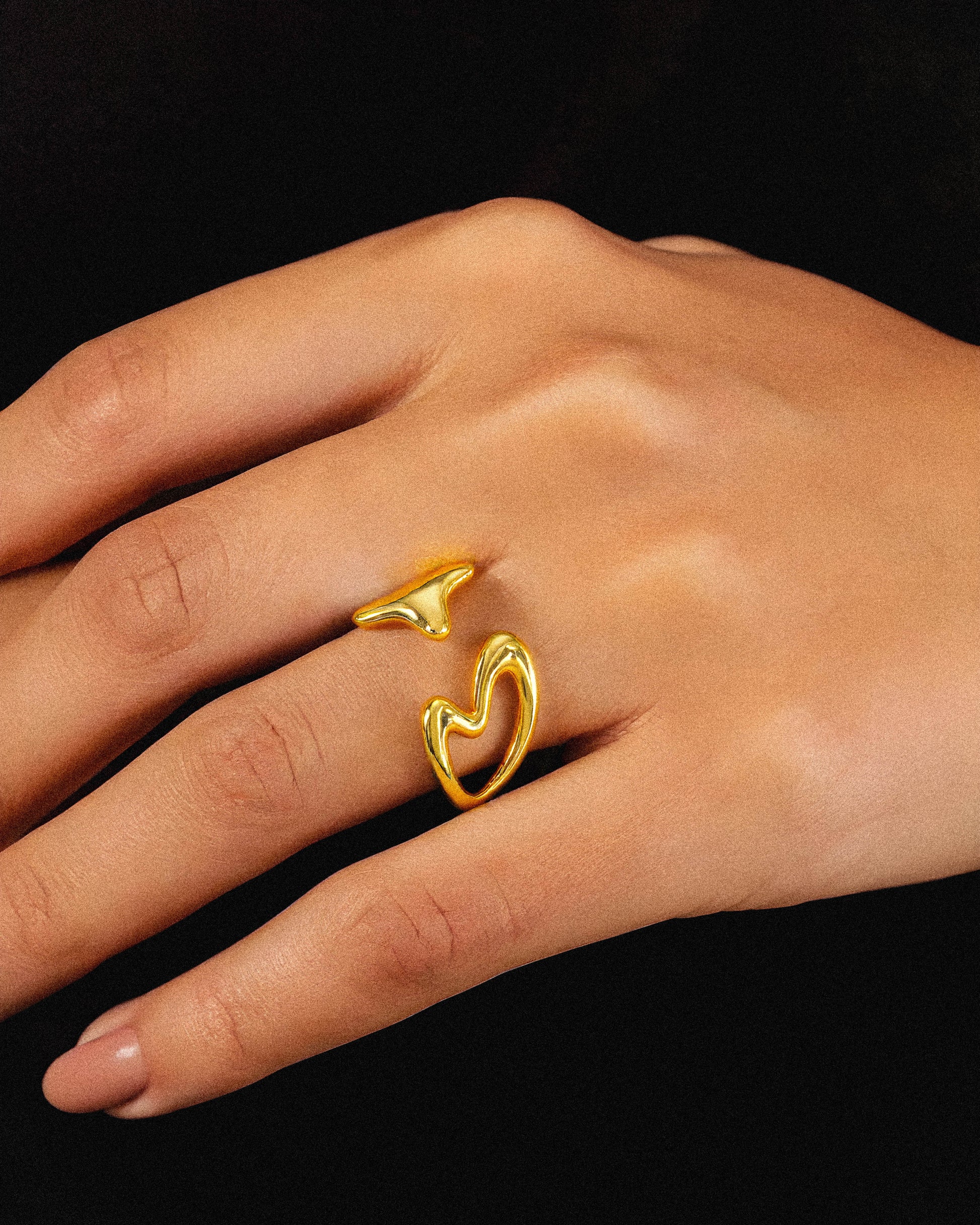 The Blushfire Ring embodies simplicity and minimalism, designed for those who value clean, elegant jewelry. Its sleek form ensures a comfortable fit while adding a subtle touch of sophistication to any outfit. Perfect for everyday wear, this ring highlights refined craftsmanship without unnecessary embellishments. on a woman's ring 1.	18k gold plated jewelry
	2.	gold plated stainless steel jewelry
	3.	tarnish free gold jewelry
	4.	waterproof gold jewelry
	5.	affordable gold jewelry
	6.	non-tarnish gold jewe