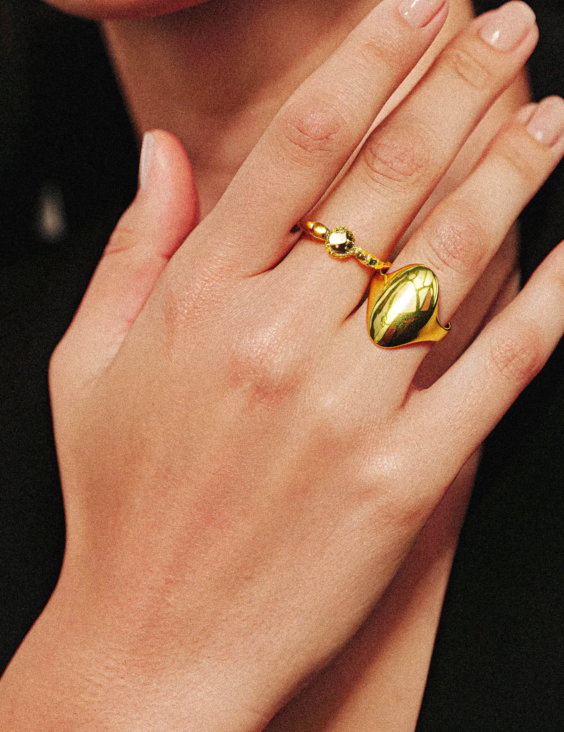 The Ember Ring features a wide band crafted with a polished gold finish, offering a sleek and luminous appearance. Its substantial width enhances durability while making a bold, sophisticated statement. Ideal for those seeking a timeless accessory that combines elegance. on a womans hand
1.	18k gold plated jewelry
	2.	gold plated stainless steel jewelry
	3.	tarnish free gold jewelry
	4.	waterproof gold jewelry
	5.	affordable gold jewelry
	6.	non-tarnish gold jewelry
	7.	hypoallergenic gold jewelry
	8.	durab